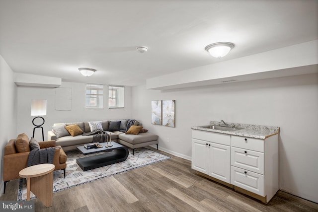 living room featuring light wood-style flooring and baseboards