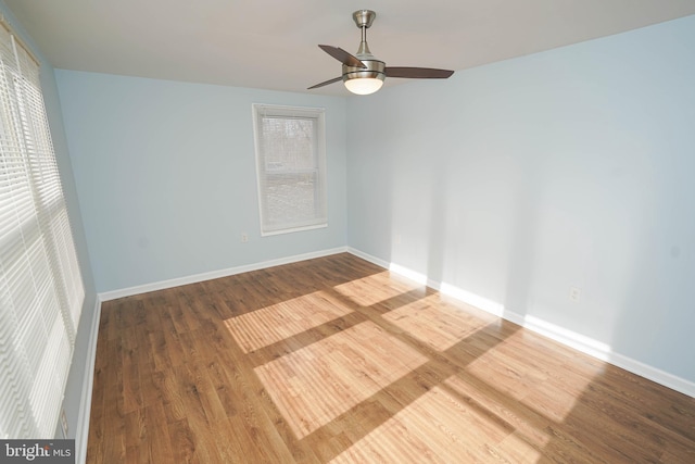 unfurnished room with ceiling fan and hardwood / wood-style floors