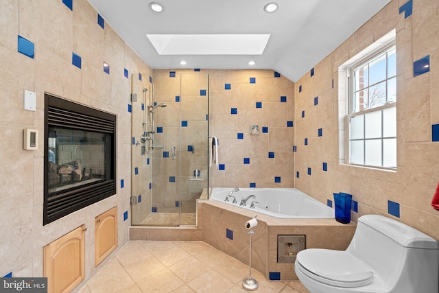 bathroom with vaulted ceiling, tile walls, tile patterned flooring, separate shower and tub, and toilet