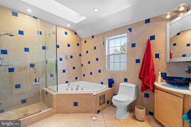 full bathroom featuring vanity, shower with separate bathtub, tile walls, and toilet