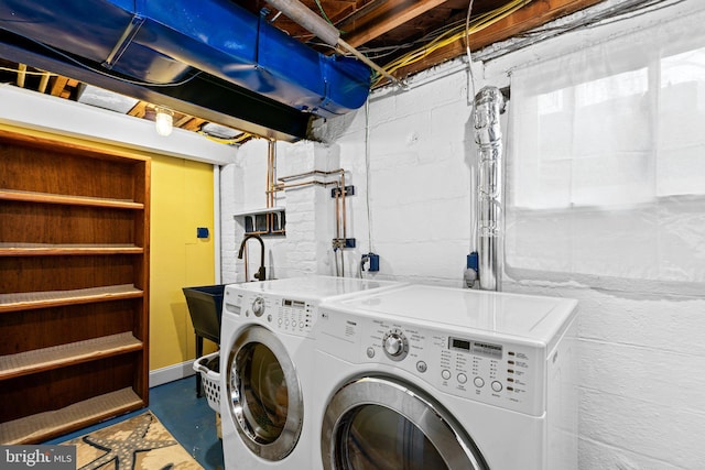 washroom featuring sink and washer and dryer