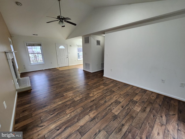 unfurnished living room with dark wood-type flooring, high vaulted ceiling, and ceiling fan