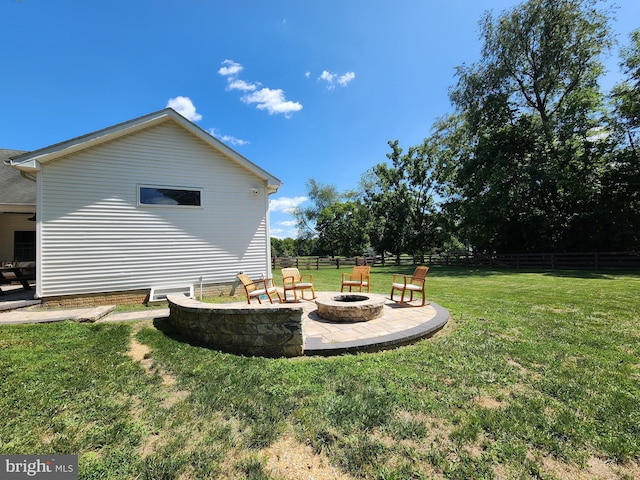 view of yard featuring a patio and a fire pit