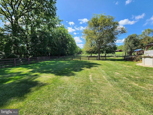 view of yard with a rural view