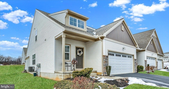 view of front of property with a porch, central AC unit, and a front lawn