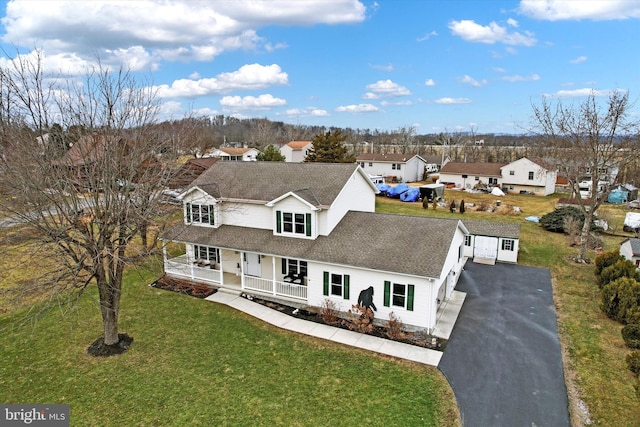 view of front of property with a front lawn and a porch