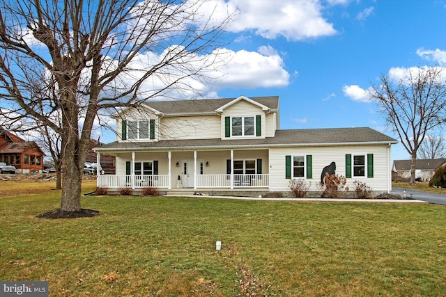 view of front of house featuring a front yard and a porch