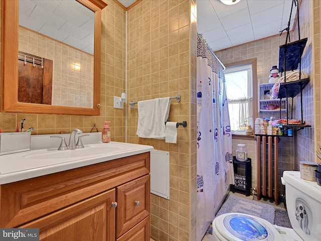 bathroom featuring vanity, tile walls, a shower with shower curtain, and toilet