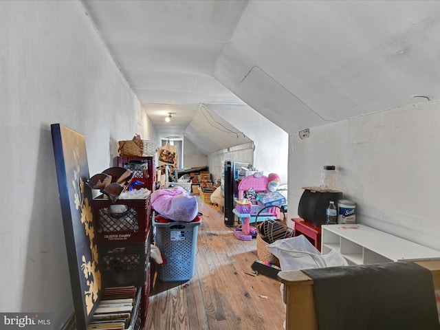 bonus room featuring hardwood / wood-style flooring and vaulted ceiling