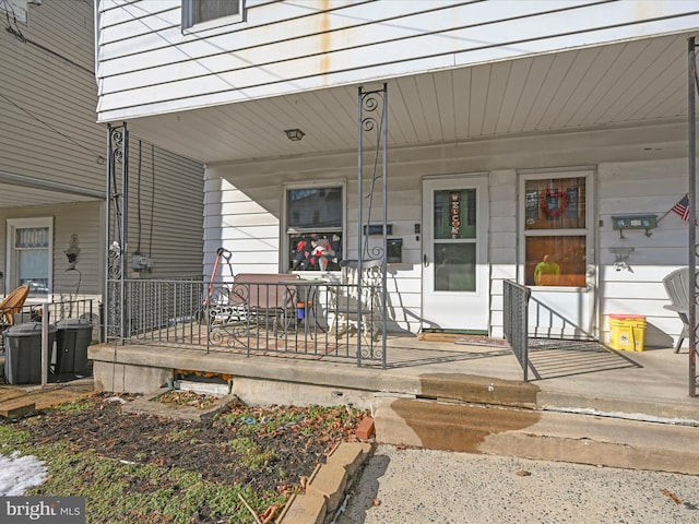 doorway to property featuring covered porch