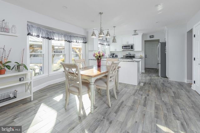 dining room with light hardwood / wood-style floors