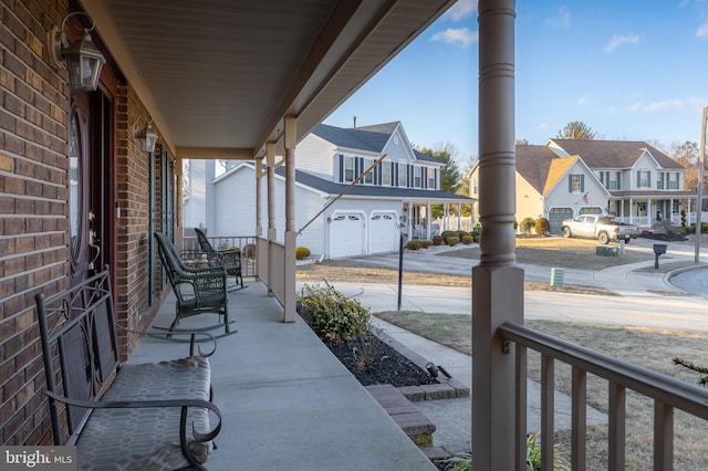 view of patio featuring a garage and covered porch