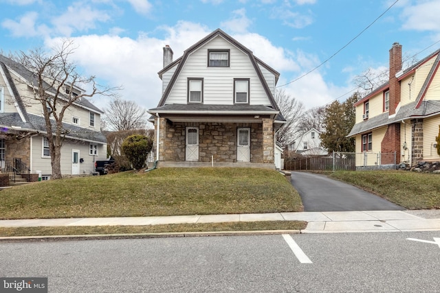 view of front of home featuring a porch and a front yard