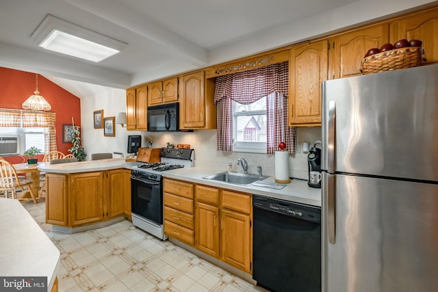 kitchen featuring lofted ceiling with beams, black appliances, sink, hanging light fixtures, and kitchen peninsula