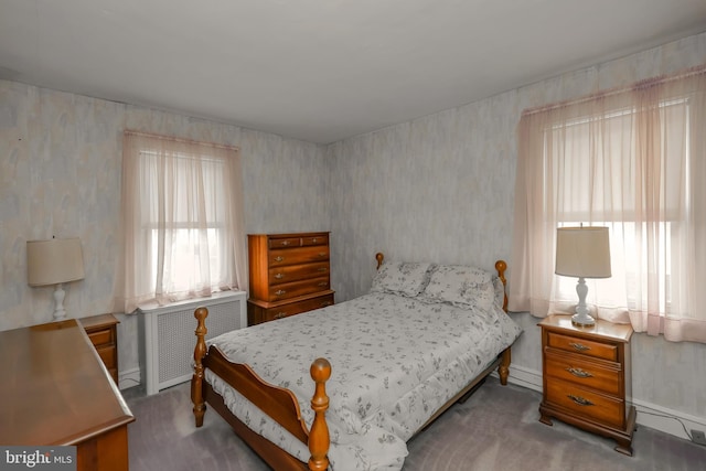 carpeted bedroom featuring radiator