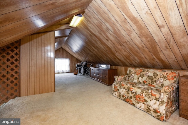 additional living space featuring lofted ceiling, light carpet, wooden ceiling, and wood walls