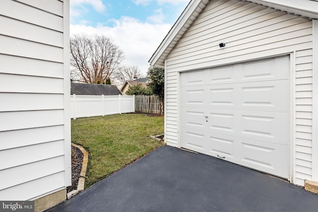 garage featuring a yard