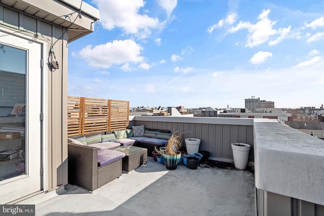 view of patio / terrace with a balcony and outdoor lounge area