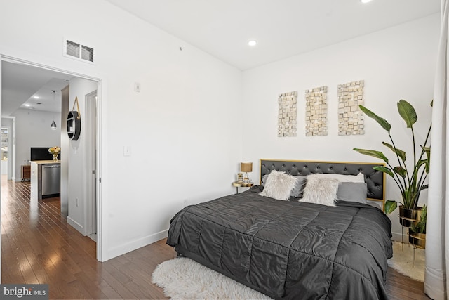 bedroom featuring dark hardwood / wood-style flooring