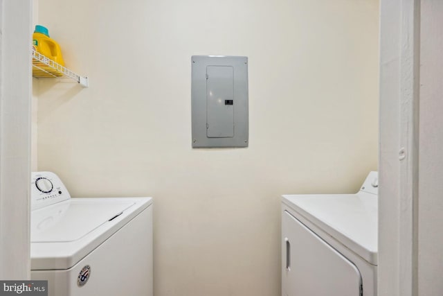 laundry area featuring washing machine and dryer and electric panel