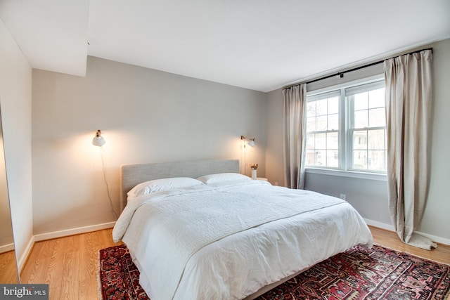 bedroom with hardwood / wood-style floors