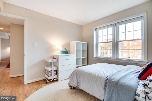 bedroom with light wood-type flooring