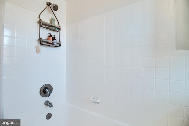 interior details with tiled shower / bath