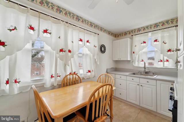 dining area with a wealth of natural light and light tile patterned flooring