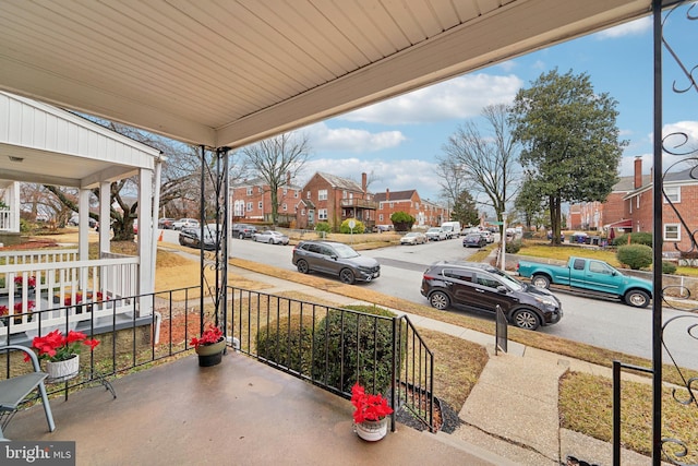 view of patio with a residential view and covered porch