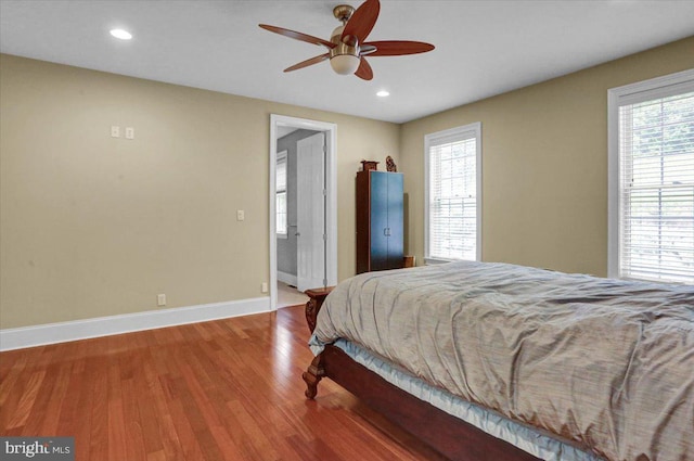 bedroom with ceiling fan and wood-type flooring