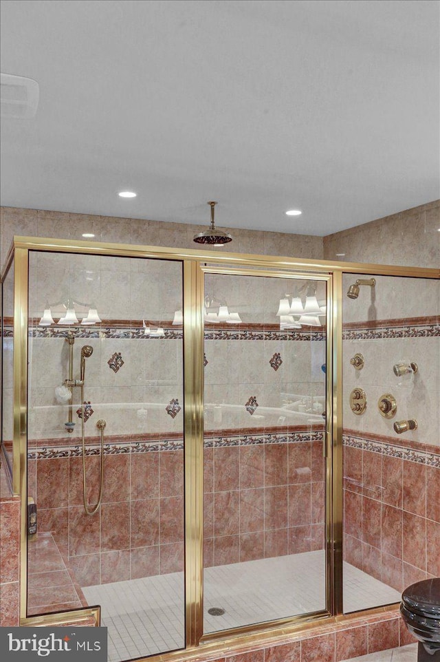 bathroom with a shower with shower door