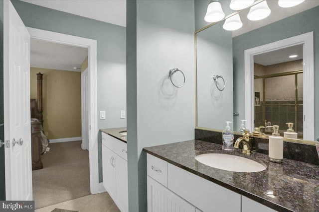 bathroom with tile patterned flooring and vanity