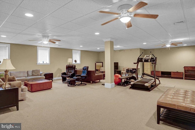 living room with carpet floors and a drop ceiling