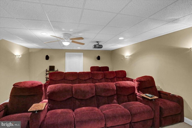 home theater featuring a paneled ceiling and ceiling fan