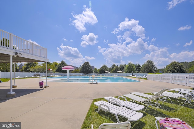 view of swimming pool with a patio area