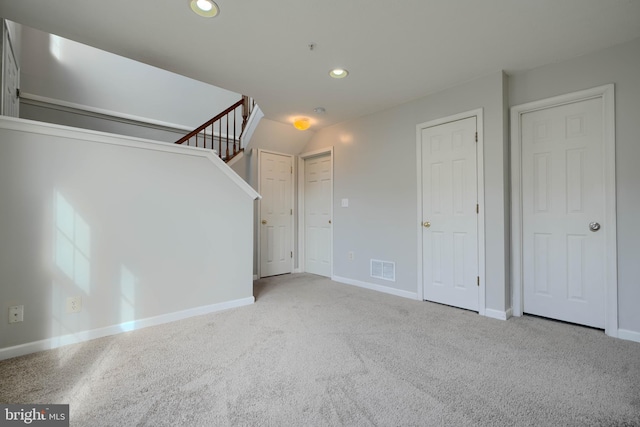 unfurnished living room featuring carpet flooring