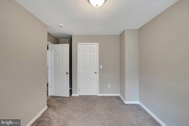 unfurnished bedroom with light carpet