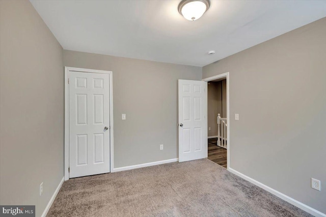 unfurnished bedroom featuring carpet flooring