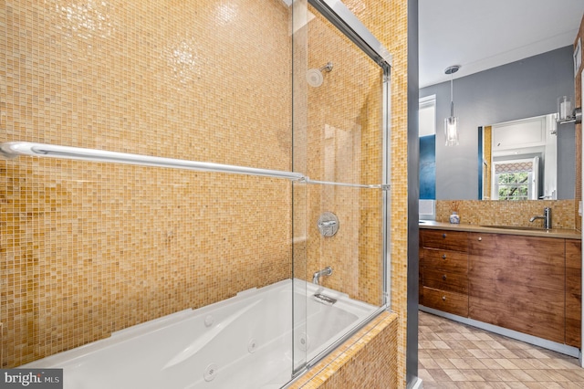 bathroom featuring vanity, tile patterned flooring, and tiled shower / bath combo