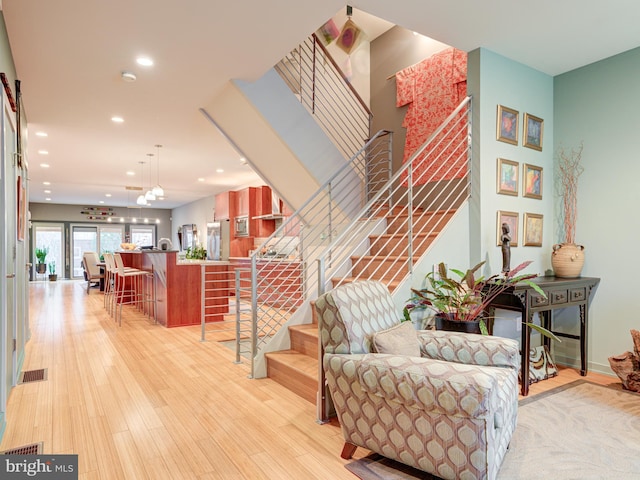 staircase featuring wood-type flooring