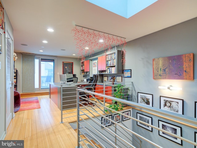 interior space featuring kitchen peninsula and light hardwood / wood-style floors