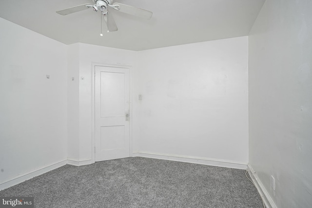 unfurnished room with ceiling fan and carpet flooring