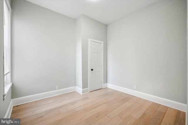 empty room with light hardwood / wood-style floors