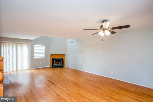 unfurnished living room with ceiling fan and light hardwood / wood-style flooring