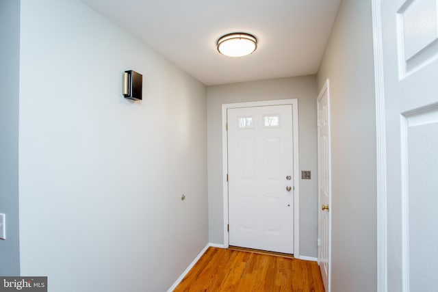 doorway with light wood-type flooring