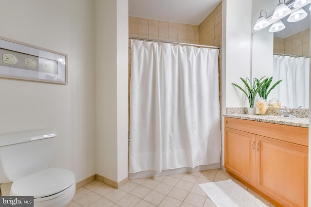 bathroom with tile patterned flooring, vanity, curtained shower, and toilet