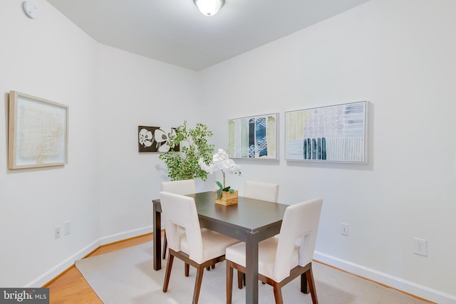 dining room with hardwood / wood-style flooring