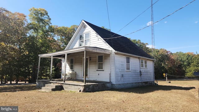 exterior space with a porch and a yard