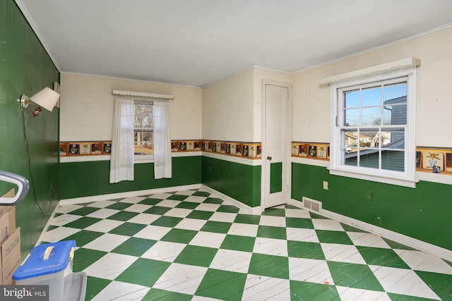 spare room featuring ornamental molding