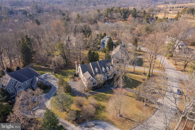 bird's eye view featuring a wooded view